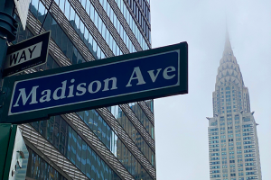 Street sign for Madison Ave with Chrysler Building in background